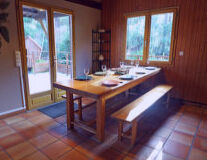 a kitchen with a table in front of a window